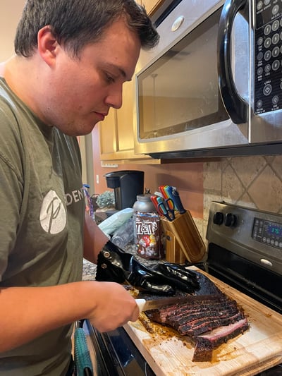 Austin slicing the brisket
