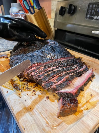 sliced brisket on cutting board