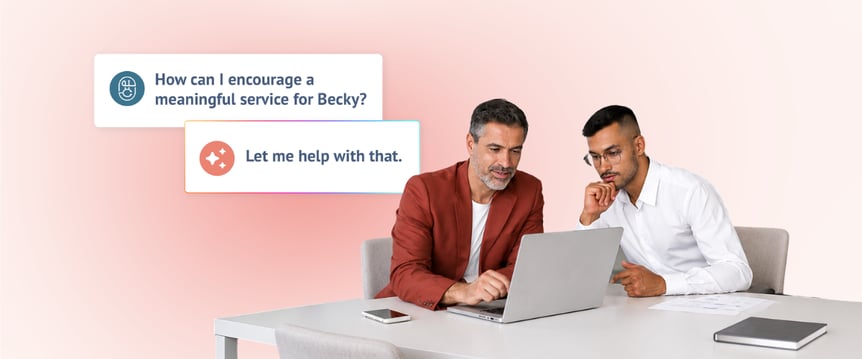 Funeral director working with a family member on laptop