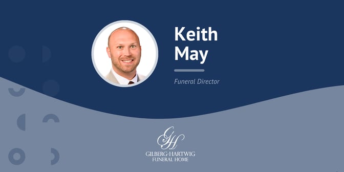 Image of funeral director Keith May with company logo