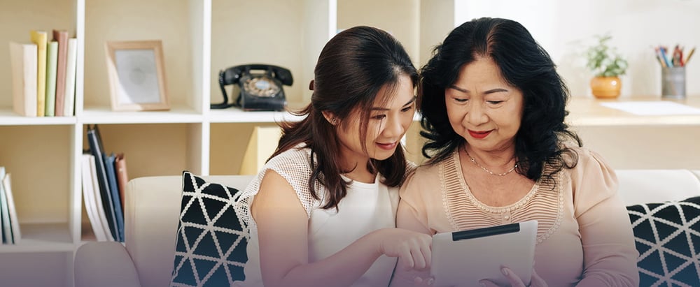 older and younger woman on tablet